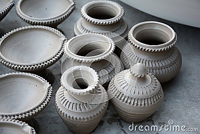 Works on traditional diya oil lamps in Bikaner, India. Stock Photo