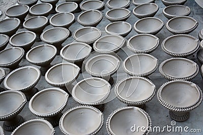 Works on traditional diya oil lamps in Bikaner, India. Stock Photo