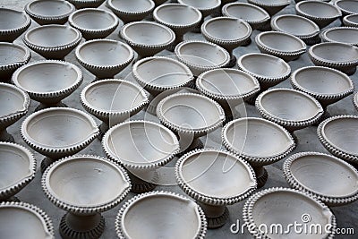 Works on traditional diya oil lamps in Bikaner, India. Stock Photo