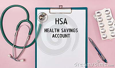 Worksheet with the inscription Health Savings Account HSA stethoscope and pills Stock Photo