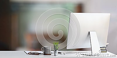 Workspace computer putting on white working desk. Stock Photo