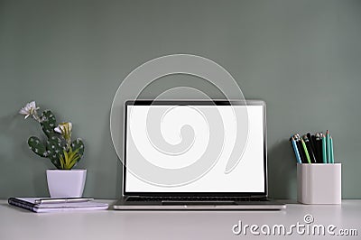 Workspace mockup laptop, pencil, notebook and cactus on desk. Stock Photo