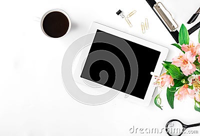 Workspace with tablet, office accessories, coffee and bouquet of Stock Photo