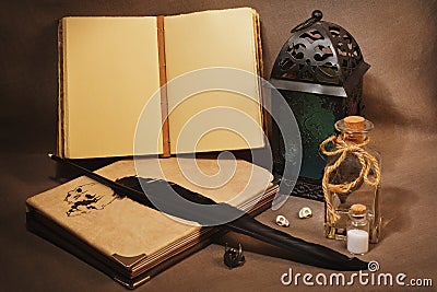 Workspace of the witch or sorcerer with old grimoires, charms an Stock Photo