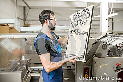 Workwe with cliche at the manufacturing Stock Photo