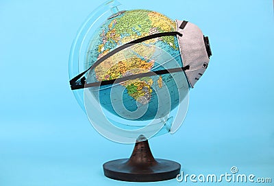 World ball with filter mask against coronavirus Stock Photo