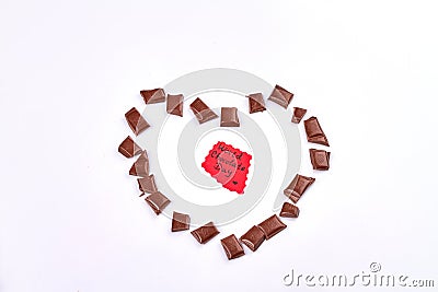 World chocolate day. Chocolate piece in the shape of heart. Stock Photo