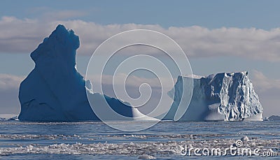 World climate change problems. Melting ice. Antarctica beautiful white frozen landscape. Floating antarctic iceberg. Stock Photo