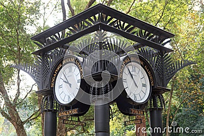World clock near orchid garden in Singapore Botanic Gardens Stock Photo