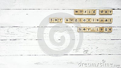 World day for audiovisual heritage .square cubes with letters Stock Photo