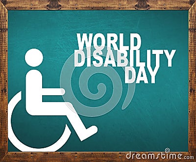 World disability day written on blue blackboard Stock Photo