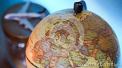 World earth globe in a decorated room with LED back lighting and candle light. Stock Photo