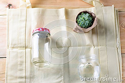 World free of plastic.Green products bag made from bamboo or reuse, succulent and glass jar on nature wood background. Stock Photo
