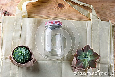 World free of plastic.Green products - bag made from bamboo or reuse, succulent and glass jar on nature wood background. Stock Photo