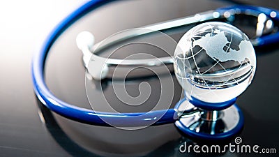 World globe crystal glass on stethoscope Stock Photo