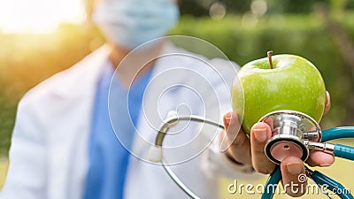 World health day, an apple a day keeps the doctor away concept for health benefit by eating high nutritious clean food and healthy Stock Photo