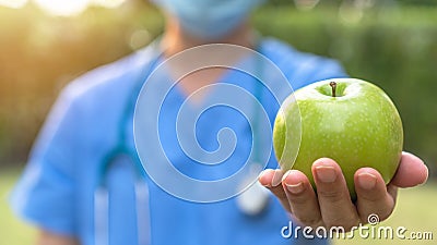 World health day, an apple a day keeps the doctor away concept for health benefit by eating high nutritious clean food and healthy Stock Photo