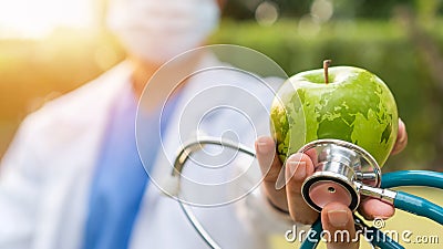 World health day, an apple a day keeps the doctor away concept for health benefit by eating high nutritious clean food and healthy Stock Photo