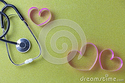 World health day background of Stethoscope with pink ribbon heart on beautiful colorful paper background,Healthcare and medical Stock Photo