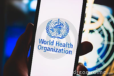 World Health Organization logo on the smartphone screen. Editorial Stock Photo