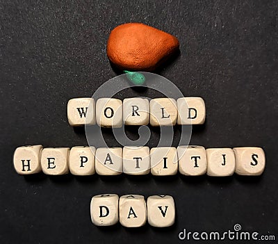 World Hepatitis Day. Liver and gall bladder. Wooden cubes inscription Stock Photo