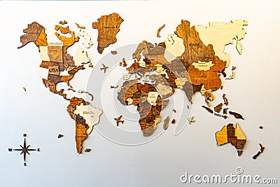 World map of earth showing continents on a wood tree ring texture background on white Stock Photo