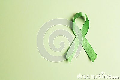World mental health day concept. Green awareness ribbon with copy space for text Stock Photo