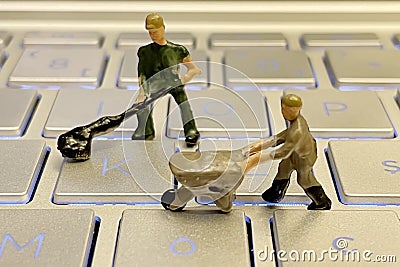 IT world and miniature working people. Stock Photo