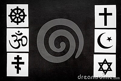 World religions concept. Christianity, Catholicism, Buddhism, Judaism, Islam symbols on black background top view copy Stock Photo