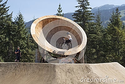 A bike rider at Crankworx Whistler 2022 practices his jumps Editorial Stock Photo