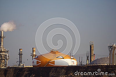 World`s largest Halloween jack o`lantern, Smilin` Jack, painted on a refinery storage tank in Wilmington, California , wears a fac Editorial Stock Photo