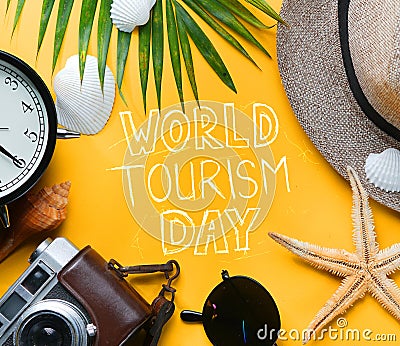 World Tourism Day Typography. Flat Lay Traveling Holiday Vacation Yellow Background Stock Photo