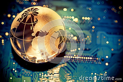 World transparent globe earth on computer motherboard. Global communications business concept. Toned Stock Photo