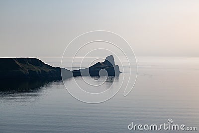 Worm`s Head along the Gower Peninsula, with Evening Light Stock Photo