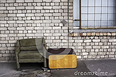 Worn chair in the street Stock Photo