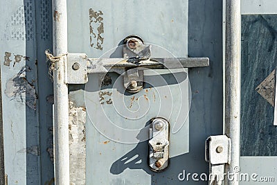 The worn door handle lock of an intermodal shipping container Stock Photo