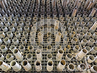 worn out supporting pipes in drained waterjet machine pool during replacement Stock Photo