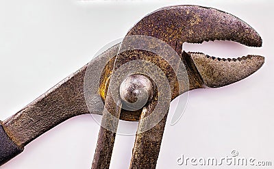 Pliers in Detail: High-Res Image of Worn and Rusted Adjustable Pliers with White Background and Copy Space. Stock Photo