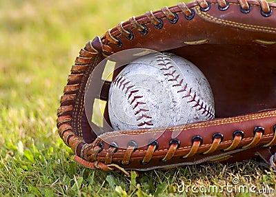 Worn Softball in Mitt Stock Photo