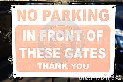 Worn White and red parking sign 