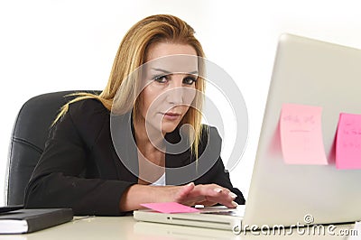 Worried attractive businesswoman in stress working with laptop c Stock Photo