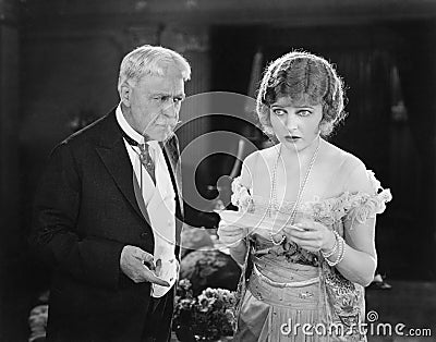 Worried father and daughter looking at a letter Stock Photo