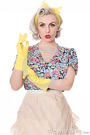 Worried fifties housewife with sink plunger, humorous concept, s Stock Photo