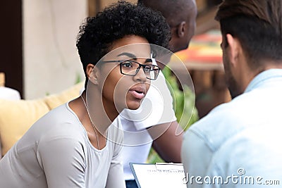 Worried millennial black woman talk with doctor sharing problems Stock Photo
