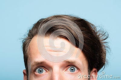 Worried nervous man alarmed look peep out bottom Stock Photo