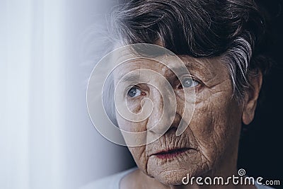 Worried old woman`s face Stock Photo