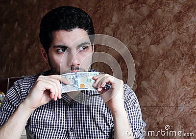 worried sad arab young businessman with dollar bill Stock Photo