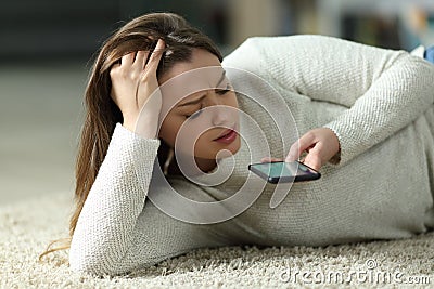 Worried teen dictating message on phone Stock Photo