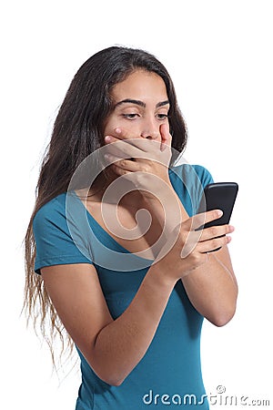 Worried teenager girl looking at smart phone Stock Photo