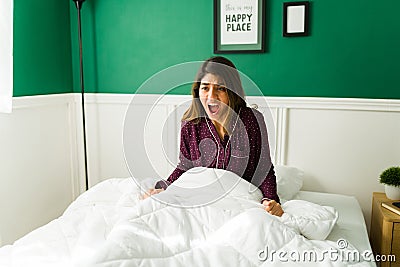 Worried woman waking up from a nightmare Stock Photo